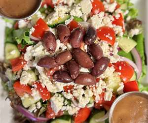 Greek salad with Kalamata olives, feta, tomatoes, cucumber & red onion