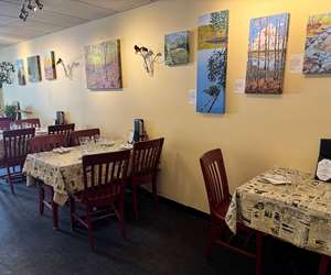 Our Dining room, featuring paintings by our very own Chef Mat