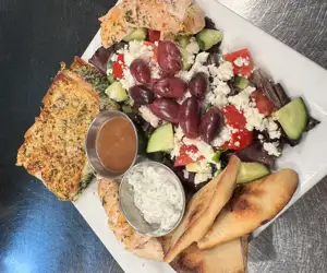 Greek Plate featuring our house-made Fresh Spanakopita. A feta lovers delight!