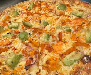 The "Morning Dew" pizza. Buffalo chicken, avocado, red pepper, onion, feta. 